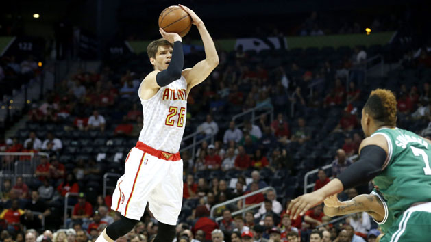 Apr 19, 2016; Atlanta, GA, USA; Atlanta Hawks guard Kyle Korver (26) attempts a three-point basket against Boston Celtics center Jared Sullinger (7) in the first quarter of game two of the first round of the NBA Playoffs at Philips Arena. The Hawks won 89-72. Mandatory Credit: Jason Getz-USA TODAY Sports