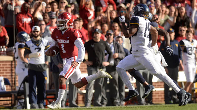Nov 25, 2017; Norman, OK, USA; Oklahoma Sooners quarterback Kyler Murray (1) runs for a long gain in front of West Virginia Mountaineers cornerback Elijah Battle (19) during the first quarter at Gaylord Family - Oklahoma Memorial Stadium. Photo Credit: Mark D. Smith-USA TODAY Sports