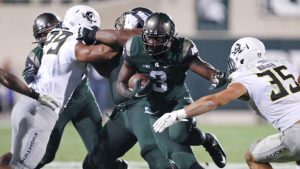 No. 5 Michigan State holds off Oregon