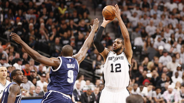 Apr 30, 2016; San Antonio, TX, USA; San Antonio Spurs power forward LaMarcus Aldridge (12) shoots the ball over Oklahoma City Thunder power forward Serge Ibaka (9) in game one of the second round of the NBA Playoffs at AT&T Center. Mandatory Credit: Soobum Im-USA TODAY Sports