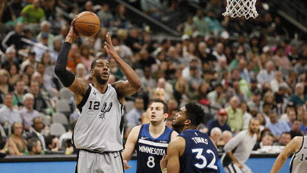 Mar 17, 2018; San Antonio, TX, USA; San Antonio Spurs power forward LaMarcus Aldridge (12) shoots the ball over Minnesota Timberwolves center Karl-Anthony Towns (32) during the first half at AT&T Center. Photo Credit: Soobum Im-USA TODAY Sports