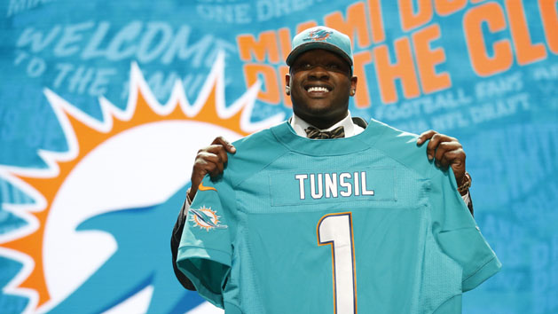Apr 28, 2016; Chicago, IL, USA; Laremy Tunsil (Mississippi) is selected by the Miami Dolphins as the number thirteen overall pick in the first round of the 2016 NFL Draft at Auditorium Theatre. Mandatory Credit: Kamil Krzaczynski-USA TODAY Sports