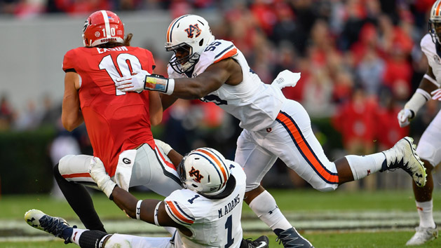 Nov 12, 2016; Athens, GA, USA; Auburn Tigers defensive tackle Montravius Adams (1) and defensive lineman Carl Lawson (55) sack Georgia Bulldogs quarterback Jacob Eason (10) during the second quarter at Sanford Stadium. Photo Credit: Dale Zanine-USA TODAY Sports