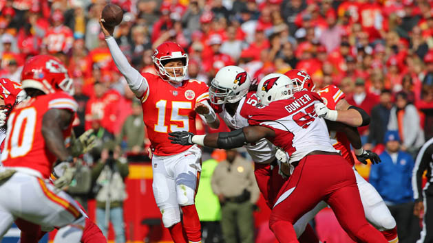 Nov 11, 2018; Kansas City, MO, USA; Kansas City Chiefs quarterback Patrick Mahomes (15) throws a pass as Arizona Cardinals linebacker Josh Bynes (57) and defensive tackle Rodney Gunter (95) defend in the first half at Arrowhead Stadium. Photo Credit: Jay Biggerstaff-USA TODAY Sports