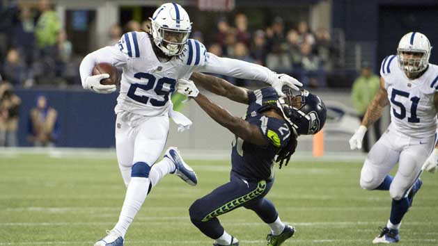 Oct 1, 2017; Seattle, WA, USA; Indianapolis Colts free safety Malik Hooker (29) stiff arms Seattle Seahawks cornerback DeAndre Elliott (21) as he runs back an interception during the second half at CenturyLink Field. The Seahawks won 46-18. Photo Credit: Troy Wayrynen-USA TODAY Sports