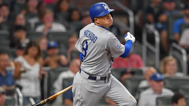 Jul 28, 2018; Atlanta, GA, USA; Los Angeles Dodgers third baseman Manny Machado (8) singles to right field against the Atlanta Braves during the seventh inning at SunTrust Park. Photo Credit: Dale Zanine-USA TODAY Sports