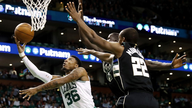 Apr 24, 2018; Boston, MA, USA; Boston Celtics guard Marcus Smart (36) shoots against Milwaukee Bucks forward Khris Middleton (22) during the fourth quarter of Boston's 92-87 win in game five of the first round of the 2018 NBA Playoffs at TD Garden. Photo Credit: Winslow Townson-USA TODAY Sports