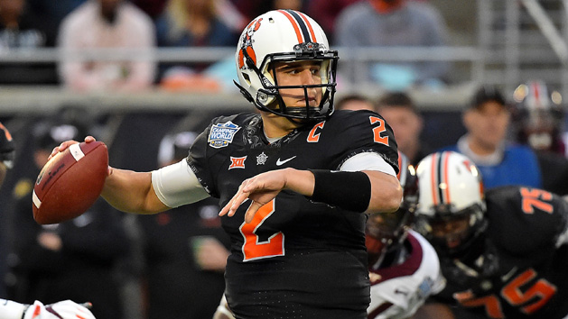 Dec 28, 2017; Orlando, FL, USA; Oklahoma State Cowboys quarterback Mason Rudolph (2) attempts a pass against the Virginia Tech Hokies during the first half in the 2017 Camping World Bowl at Camping World Stadium. Photo Credit: Jasen Vinlove-USA TODAY Sports