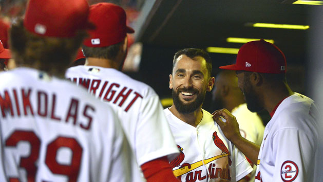 Jun 26, 2018; St. Louis, MO, USA; St. Louis Cardinals third baseman Matt Carpenter (13) is congratulated by teammates after hitting his second solo home run of the game in the eighth inning at Busch Stadium. Carpenter went five for five in the game. Photo Credit: Jeff Curry-USA TODAY Sports