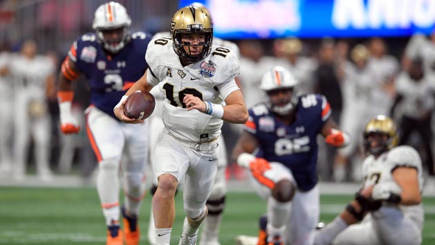 Jan 1, 2018; Atlanta, GA, USA; Central Florida Knights quarterback McKenzie Milton (10) runs for a touchdown against the Auburn Tigers during the first half at Mercedes-Benz Stadium. Photo Credit: Dale Zanine-USA TODAY Sports