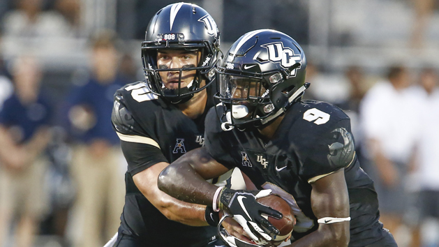 Sep 21, 2018; Orlando, FL, USA; UCF Knights quarterback McKenzie Milton (10) hands off to running back Adrian Killins Jr. (9) during the first quarter against the Florida Atlantic Owls at Spectrum Stadium. Photo Credit: Reinhold Matay-USA TODAY Sports