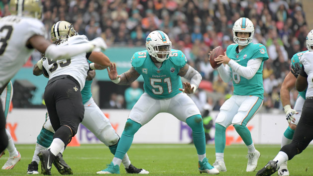 Oct 1, 2017; London, United Kingdom; Miami Dolphins center Mike Pouncey (51) defends as quarterback Jay Cutler (6) prepares to throw a pass against the New Orleans Saints during the NFL International Series game at Wembley Stadium. The Saints defeated the Dolphins 20-0. Photo Credit: Kirby Lee-USA TODAY Sports