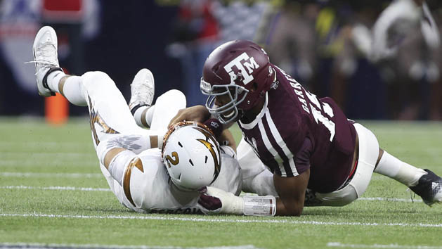 Sep 5, 2015; Houston, TX, USA; Arizona State Sun Devils quarterback Mike Bercovici (2) is sacked by Texas A&M Aggies defensive lineman Myles Garrett (15) during the first quarter at NRG Stadium. Mandatory Credit: Troy Taormina-USA TODAY Sports