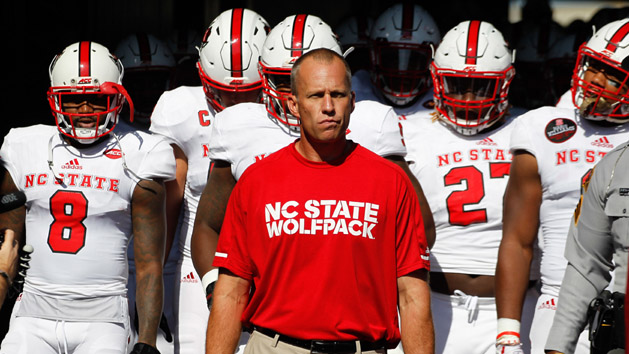 Oct 14, 2017; Pittsburgh, PA, USA; North Carolina State Wolfpack head coach Dave Doeren (middle) leads his team from the tunnel to play the Pittsburgh Panthers at Heinz Field. The Wolfpack won 35-17. Photo Credit: Charles LeClaire-USA TODAY Sports