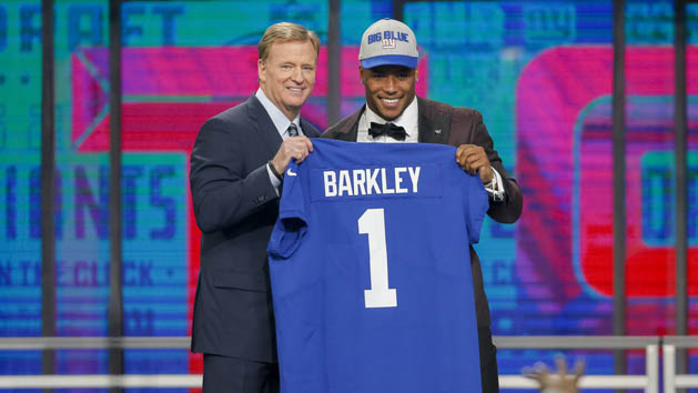 Apr 26, 2018; Arlington, TX, USA; Saquon Barkley (Penn State) poses with NFL commissioner Roger Goodell after being selected as the number two overall pick to the New York Giants in the first round of the 2018 NFL Draft at AT&T Stadium. Photo Credit: Tim Heitman-USA TODAY Sports