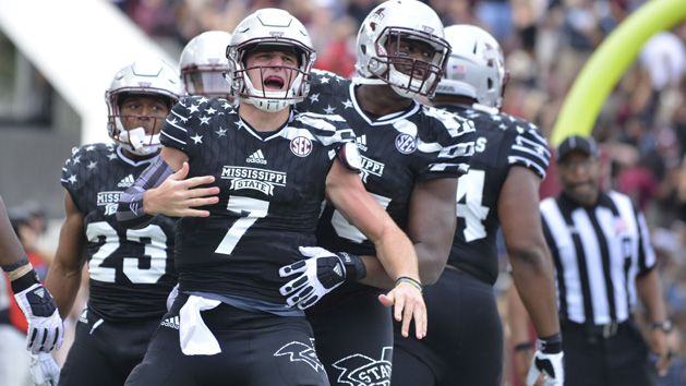 Nov 5, 2016; Starkville, MS, USA; Mississippi State Bulldogs quarterback Nick Fitzgerald (7) celebrates with teammates after a touchdown in the third quarter against the Texas A&M Aggies at Davis Wade Stadium. Mississippi State won 35-28. Photo Credit: Matt Bush-USA TODAY Sports