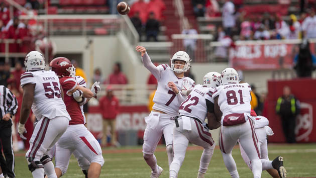 Nov 18, 2017; Fayetteville, AR, USA; Mississippi State Bulldogs quarterback Nick Fitzgerald (7) throws a pass for an eventual touchdown during the fourth quarter of the game against the Arkansas Razorbacks at Donald W. Reynolds Razorback Stadium. Mississippi State Bulldogs won 28-21. Photo Credit: Brett Rojo-USA TODAY Sports