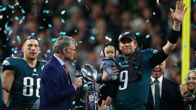 Feb 4, 2018; Minneapolis, MN, USA; Philadelphia Eagles quarterback Nick Foles (9) celebrates with daughter Lily and the Vince Lombardi Trophy after defeating the New England Patriots in Super Bowl LII at U.S. Bank Stadium. Photo Credit: Mark J. Rebilas-USA TODAY Sports