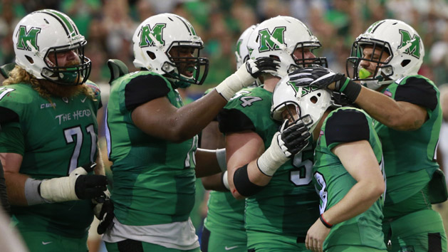 Dec 26, 2015; St. Petersburg, FL, USA; Marshall Thundering Herd place kicker Nick Smith (48) is congratulated by teammates as he made a field goal against the Connecticut Huskies during the fourth quarter at Tropicana Field. Marshall Thundering Herd defeated the Connecticut Huskies 16-10. Mandatory Credit: Kim Klement-USA TODAY Sports