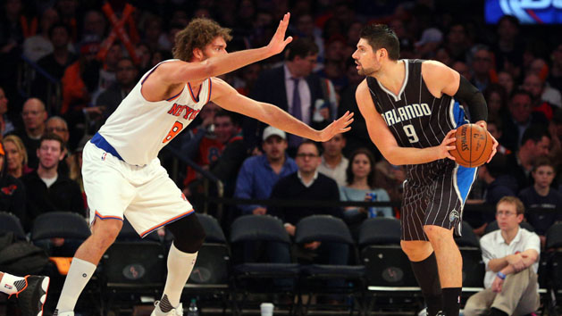 Dec 21, 2015; New York, NY, USA; Orlando Magic center Nikola Vucevic (9) controls the ball against New York Knicks center Robin Lopez (8) during the third quarter at Madison Square Garden. The Magic defeated the Knicks 107-99. Mandatory Credit: Brad Penner-USA TODAY Sports