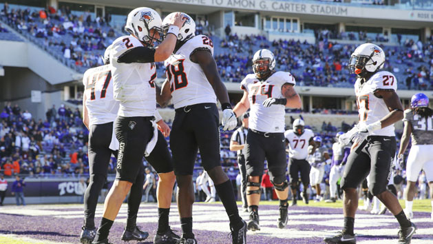 Nov 19, 2016; Fort Worth, TX, USA; Oklahoma State Cowboys quarterback Mason Rudolph (2) celebrates with wide receiver James Washington (28) after running for a touchdown during the second half against the TCU Horned Frogs at Amon G. Carter Stadium. Photo Credit: Kevin Jairaj-USA TODAY Sports