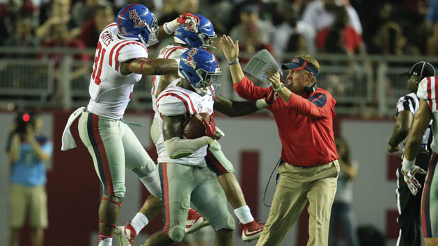 Sep 19, 2015; Tuscaloosa, AL, USA; Mississippi Rebels head coach Hugh Freeze reacts with his defense after they intercepted a pass late in the game and went on to defeated the Alabama Crimson Tide at Bryant-Denny Stadium. The Rebels defeated the Tide 43-37. Mandatory Credit: Marvin Gentry-USA TODAY Sports