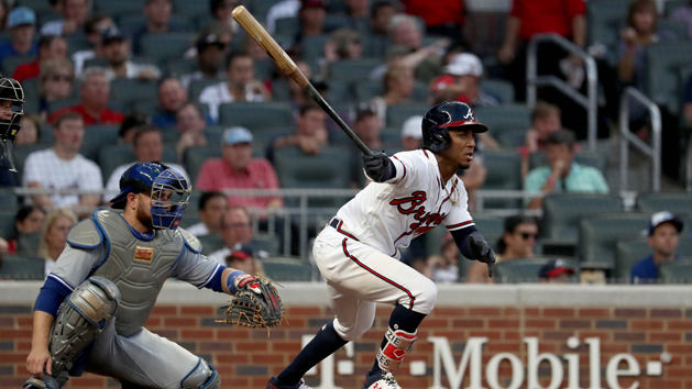 Jul 10, 2018; Atlanta, GA, USA; Atlanta Braves second baseman Ozzie Albies (1) hits a single in the fourth inning as Toronto Blue Jays catcher Russell Martin (55) looks on at SunTrust Park. Photo Credit: Jason Getz-USA TODAY Sports