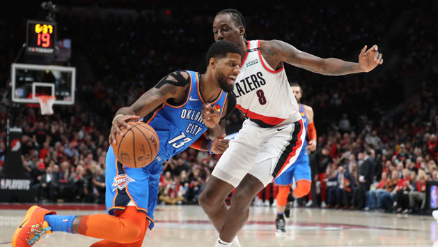 Apr 14, 2019; Portland, OR, USA; Oklahoma City Thunder forward Paul George (13) moves against Portland Trail Blazers forward Al-Farouq Aminu (8) in the first half in game one of the first round of the 2019 NBA Playoffs at Moda Center. Photo Credit: Jaime Valdez-USA TODAY Sports