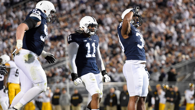 Nov 5, 2016; University Park, PA, USA; Penn State Nittany Lions defensive tackle Kevin Givens (30) reacts with teammates linebacker Brandon Bell (11) and defensive tackle Robert Windsor (54) following his sack of Iowa Hawkeyes quarterback C.J. Beathard (not pictured) during the third quarter at Beaver Stadium. Penn State defeated Iowa 41-14. Photo Credit: Rich Barnes-USA TODAY Sports
