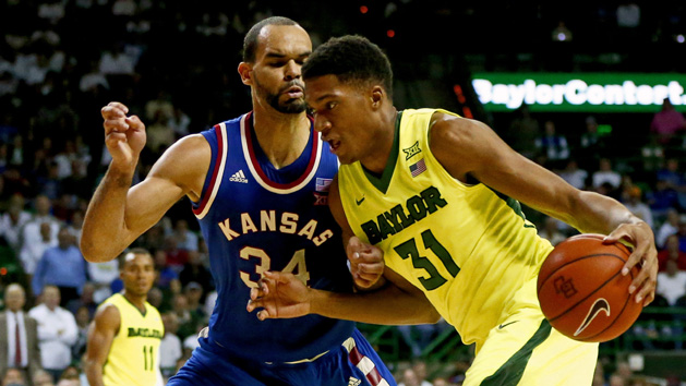 Feb 23, 2016; Waco, TX, USA; Baylor Bears forward Terry Maston (31) dribbles as Kansas Jayhawks forward Perry Ellis (34) defends during the second half at Ferrell Center. Photo Credit: Kevin Jairaj-USA TODAY Sports