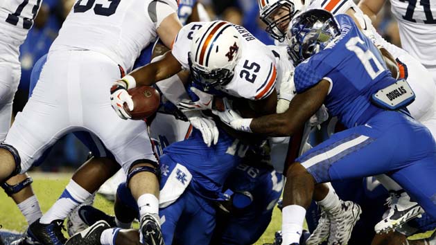 Oct 15, 2015; Lexington, KY, USA; Auburn Tigers running back Peyton Barber (25) dives for a touchdown against the Kentucky Wildcats in the second half at Commonwealth Stadium. Auburn defeated Kentucky 30-27. Mandatory Credit: Mark Zerof-USA TODAY Sports