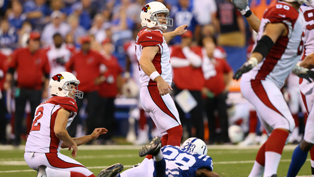 Sep 17, 2017; Indianapolis, IN, USA; Arizona Cardinals kicker Phil Dawson (4) kicks the game winning field goal under pressure from Indianapolis Colts cornerback Chris Milton (28) in the overtime quarter at Lucas Oil Stadium. At left is Arizona Cardinals holder Andy Lee (2) Photo Credit: Aaron Doster-USA TODAY Sports