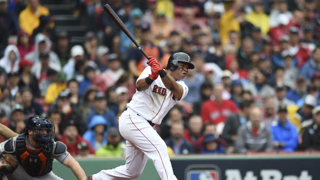 Oct 9, 2017; Boston, MA, USA; Boston Red Sox third baseman Rafael Devers (right) hits a single against Houston Astros catcher Brian McCann (left) during the second inning in game four of the 2017 ALDS playoff baseball series at Fenway Park. Photo Credit: Bob DeChiara-USA TODAY Sports
