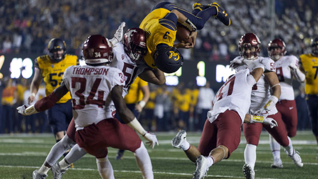 Oct 13, 2017; Berkeley, CA, USA; California Golden Bears quarterback Ross Bowers (3) leaps for a touchdown against Washington State Cougars linebacker Justus Rogers (37) during the second half at Memorial Stadium. Photo Credit: Neville E. Guard-USA TODAY Sports
