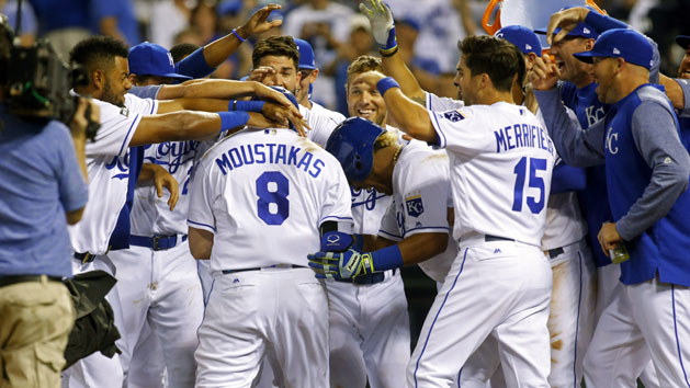 Jun 6, 2017; Kansas City, MO, USA; Kansas City Royals players congratulate designated hitter Mike Moustakas (8) at home plate after hitting a walk-off home run against the Houston Astros in the ninth inning at Kauffman Stadium. The Royals won 9-7. Photo Credit: Jay Biggerstaff-USA TODAY Sports