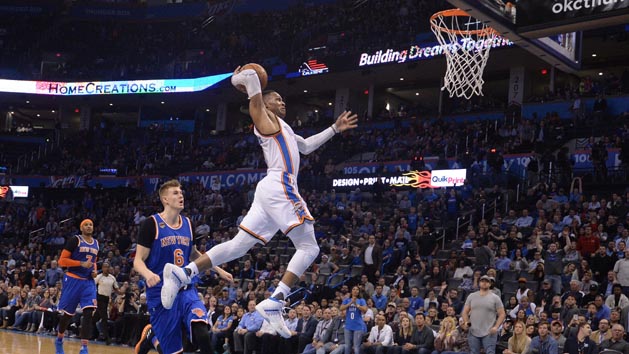 Feb 15, 2017; Oklahoma City, OK, USA; Oklahoma City Thunder guard Russell Westbrook (0) dunks the ball in front of New York Knicks forward Kristaps Porzingis (6) during the fourth quarter at Chesapeake Energy Arena. Photo Credit: Mark D. Smith-USA TODAY Sports