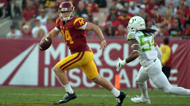 Nov 5, 2016; Los Angeles, CA, USA; Southern California Trojans quarterback Sam Darnold (14) is pressured by Oregon Ducks linebacker De'Quan McDowell (54) during a NCAA football game at Los Angeles Memorial Coliseum. Photo Credit: Kirby Lee-USA TODAY Sports
