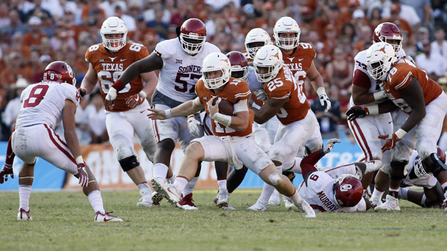 Oct 14, 2017; Dallas, TX, USA; Texas Longhorns quarterback Sam Ehlinger (11) runs against Oklahoma Sooners linebacker Kenneth Murray (9) in the fourth quarter at the Cotton Bowl. Photo Credit: Tim Heitman-USA TODAY Sports