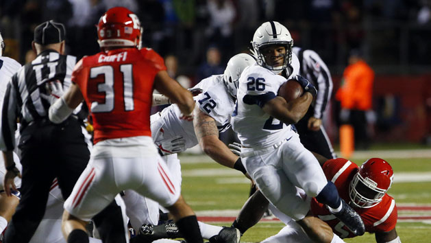 Nov 19, 2016; Piscataway, NJ, USA; Penn State Nittany Lions running back Saquon Barkley (26) rushes against Rutgers Scarlet Knights defensive back Anthony Cioffi (31) during first half at High Points Solutions Stadium. Photo Credit: Noah K. Murray-USA TODAY Sports