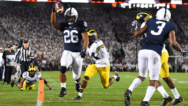 Oct 21, 2017; University Park, PA, USA; Penn State Nittany Lions running back Saquon Barkley (26) runs into the end zone for a touchdown against the Michigan Wolverines during the first quarter at Beaver Stadium. Photo Credit: Rich Barnes-USA TODAY Sports