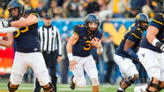 Oct 22, 2016; Morgantown, WV, USA; West Virginia Mountaineers quarterback Skyler Howard (3) runs the ball during the second quarter against the TCU Horned Frogs at Milan Puskar Stadium. Photo Credit: Ben Queen-USA TODAY Sports