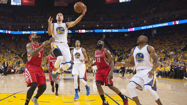 Steph Curry scores against the Rockets in Game 1 of the opening round of the 2016 NBA Playoffs. (Kyle Terada-USA TODAY Sports.)