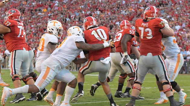 Oct 1, 2016; Athens, GA, USA; Tennessee Volunteers defensive end Derek Barnett (9) hits Georgia Bulldogs quarterback Jacob Eason (10) causing a fumble recovered by Tennessee for a touchdown during the fourth quarter at Sanford Stadium. Tennessee defeated Georgia 34-31. Photo Credit: Dale Zanine-USA TODAY Sports