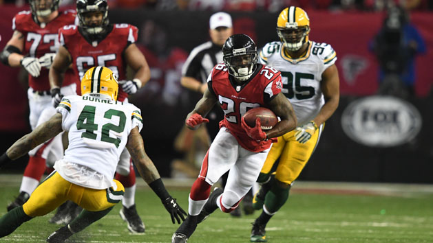 Jan 22, 2017; Atlanta, GA, USA; Atlanta Falcons running back Tevin Coleman (26) runs the ball against Green Bay Packers strong safety Morgan Burnett (42) during the second quarter in the 2017 NFC Championship Game at the Georgia Dome. Photo Credit: John David Mercer-USA TODAY Sports