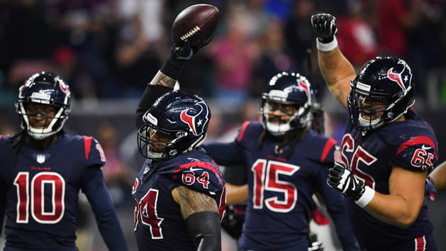 Oct 25, 2018; Houston, TX, USA; Houston Texans offensive guard Senio Kelemete (64) spikes the ball after a touchdown by wide receiver DeAndre Hopkins (10) during the fourth quarter against the Miami Dolphins at NRG Stadium. Photo Credit: Shanna Lockwood-USA TODAY Sports