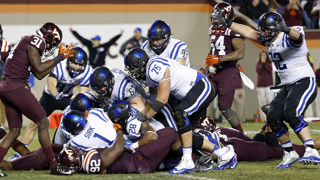 Oct 24, 2015; Blacksburg, VA, USA; Duke Blue Devils quarterback Thomas Sirk (1) scores the game-winning two point conversion as Virginia Tech Hokies defensive tackle Luther Maddy (92) defends in quadruple overtime at Lane Stadium. The Blue Devils won 45-43 in quadruple overtime. Mandatory Credit: Geoff Burke-USA TODAY Sports