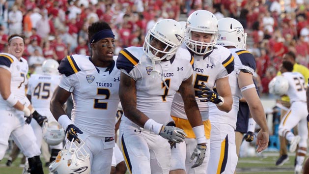 Sep 12, 2015; Little Rock, AR, USA; The Toledo Rockets celebrate against the Arkansas Razorbacks at War Memorial Stadium. Mandatory Credit: Mark D. Smith-USA TODAY Sports