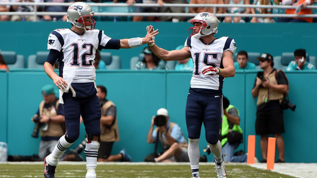 Jan 1, 2017; Miami Gardens, FL, USA; New England Patriots wide receiver Chris Hogan (right) greets Patriots quarterback Tom Brady (left) after they scored a touchdown against Miami Dolphins during the first half at Hard Rock Stadium.Credit: Steve Mitchell-USA TODAY Sports