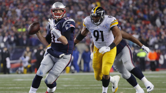 Jan 22, 2017; Foxborough, MA, USA; New England Patriots quarterback Tom Brady (12) throws a pass while pressured by Pittsburgh Steelers defensive end Stephon Tuitt (91) during the fourth quarter in the 2017 AFC Championship Game at Gillette Stadium. Photo Credit: Winslow Townson-USA TODAY Sports