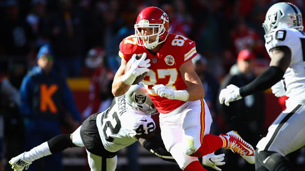 Dec 10, 2017; Kansas City, MO, USA; Kansas City Chiefs tight end Travis Kelce (87) runs against Oakland Raiders safety Karl Joseph (42) and linebacker Nicholas Morrow (50) in the first half at Arrowhead Stadium. Photo Credit: Jay Biggerstaff-USA TODAY Sports